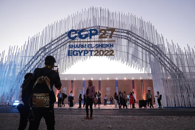 <p>Attendees outside the entrance of the Cop27 climate conference on in Sharm El Sheikh, Egypt</p>