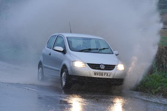 A weather warning saying heavy rain could lead to flooding has been issued for large parts of south-east England (PA)