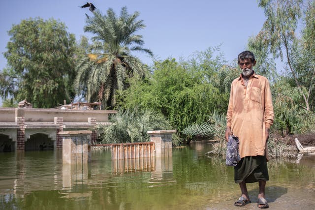 <p>Ali Sher Langah lives in his village despite being surrounded with water as he didn't want to leave his house </p>
