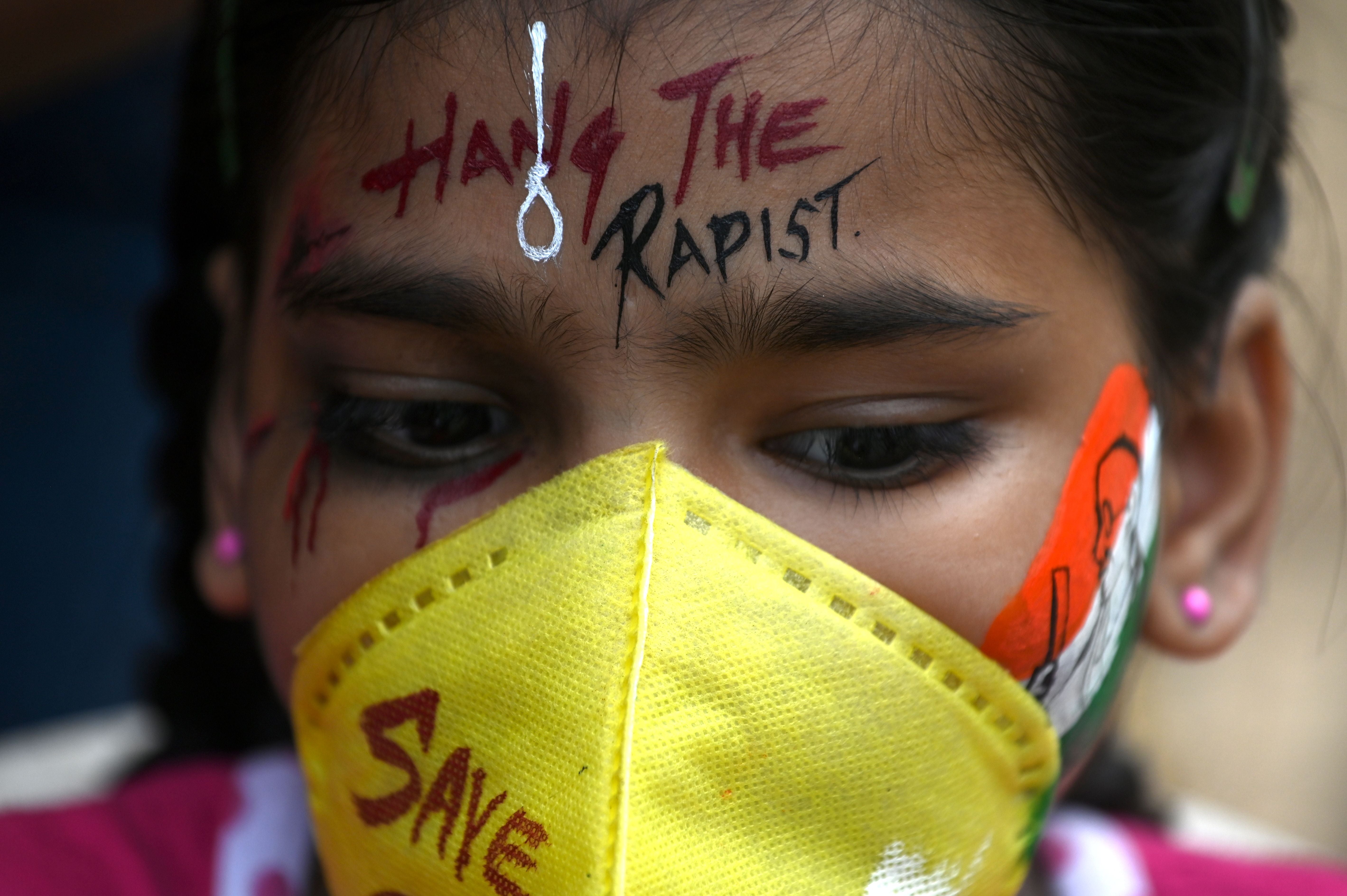 FIle image: A student gets her face painted to condemn the alleged gang-rape of 19-year-old woman victim by four men in Bool Garhi village of Uttar Pradesh state, in Mumbai