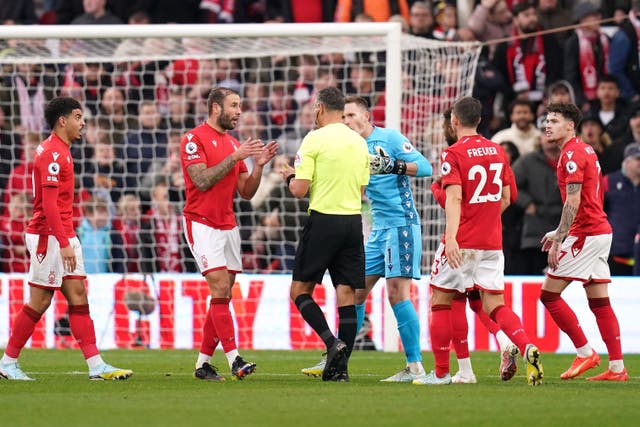 Nottingham Forest argue with referee Andre Marriner (John Walton/PA)