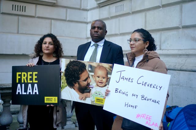 Shadow foreign secretary, David Lammy, with Mona (left) and Sanaa Seif, the sisters of writer Alaa Abd el-Fattah who has been detained in Egypt for the best part of a decade (Victoria Jones/PA)