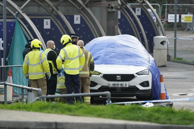 Emergency services surround the car (PA)
