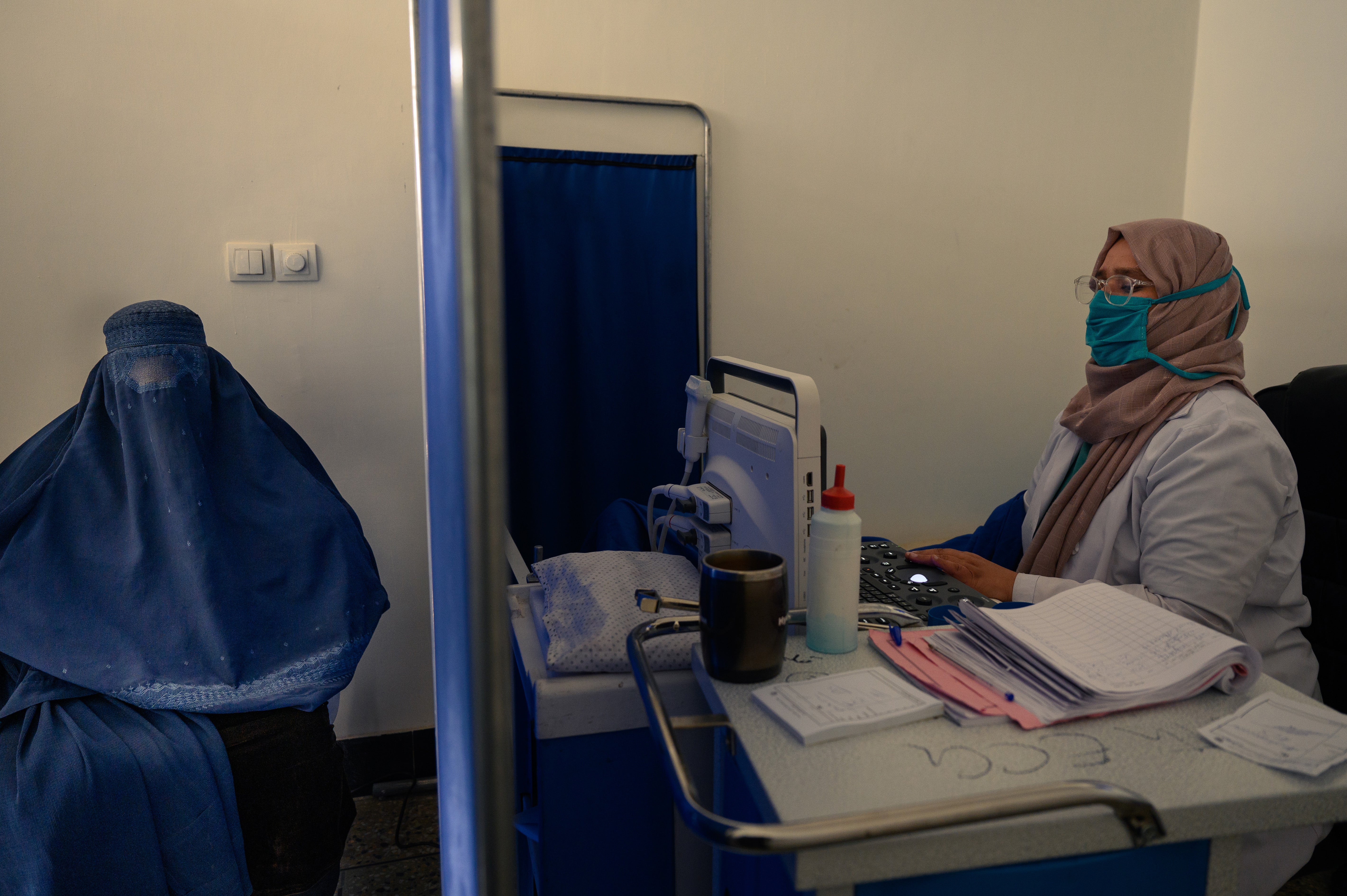 Sonologist Dr Hooria receives a patient, while another waits for her turn