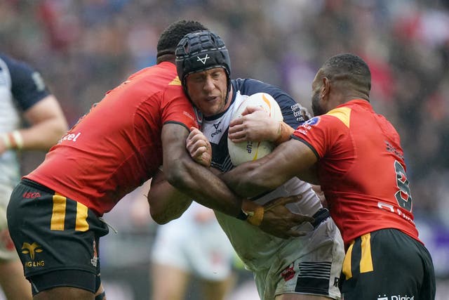 Chris Hill tangles with Papua New Guinea’s Wellington Albert (left) and Edwin Ipape during England’s quarter-final (PA Images/Tim Goode)