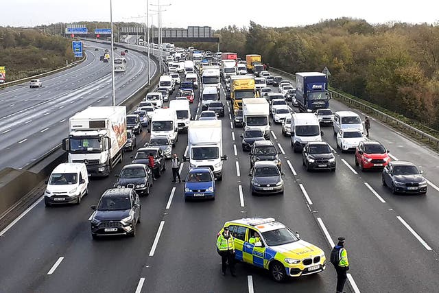 The men were arrested as action took place on the M25 (Just Stop Oil/PA)