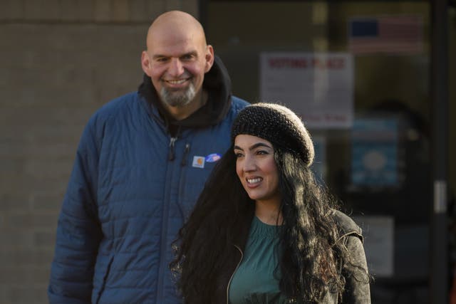 <p>Pennsylvania Democratic Senate candidate John Fetterman and his wife, Gisele, leave their polling place after casting their votes at the New Hope Baptist Church on November 8</p>