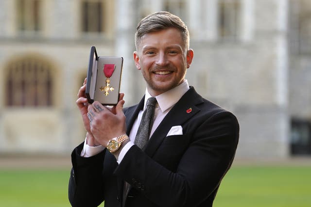 Adam Peaty after being made an OBE (Andrew Matthews/PA)