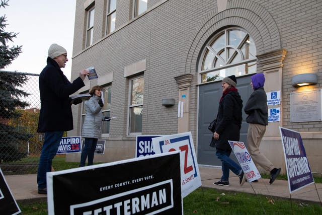 <p>Voters arrive at a polling place in Pittsburgh Sterrett 6-8 school during the US midterm elections, in Pittsburgh, Pennsylvania, on November 8, 2022</p>