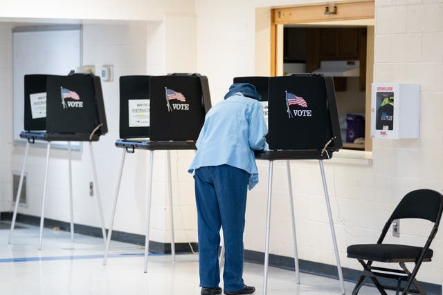 <p>A voter casts a ballot on November 8, 2022 in Winston Salem, North Carolina</p>