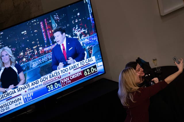 <p>People take a selfie during an election night watch party for the Republican House representative Kevin McCarthy</p>