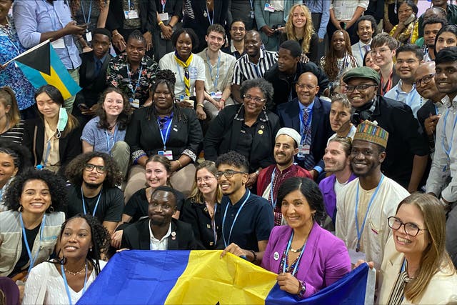 <p>Barbados Prime Minister Mia Mottley with young climate activists at Cop27 in Sharm el-Sheikh, Egypt</p>