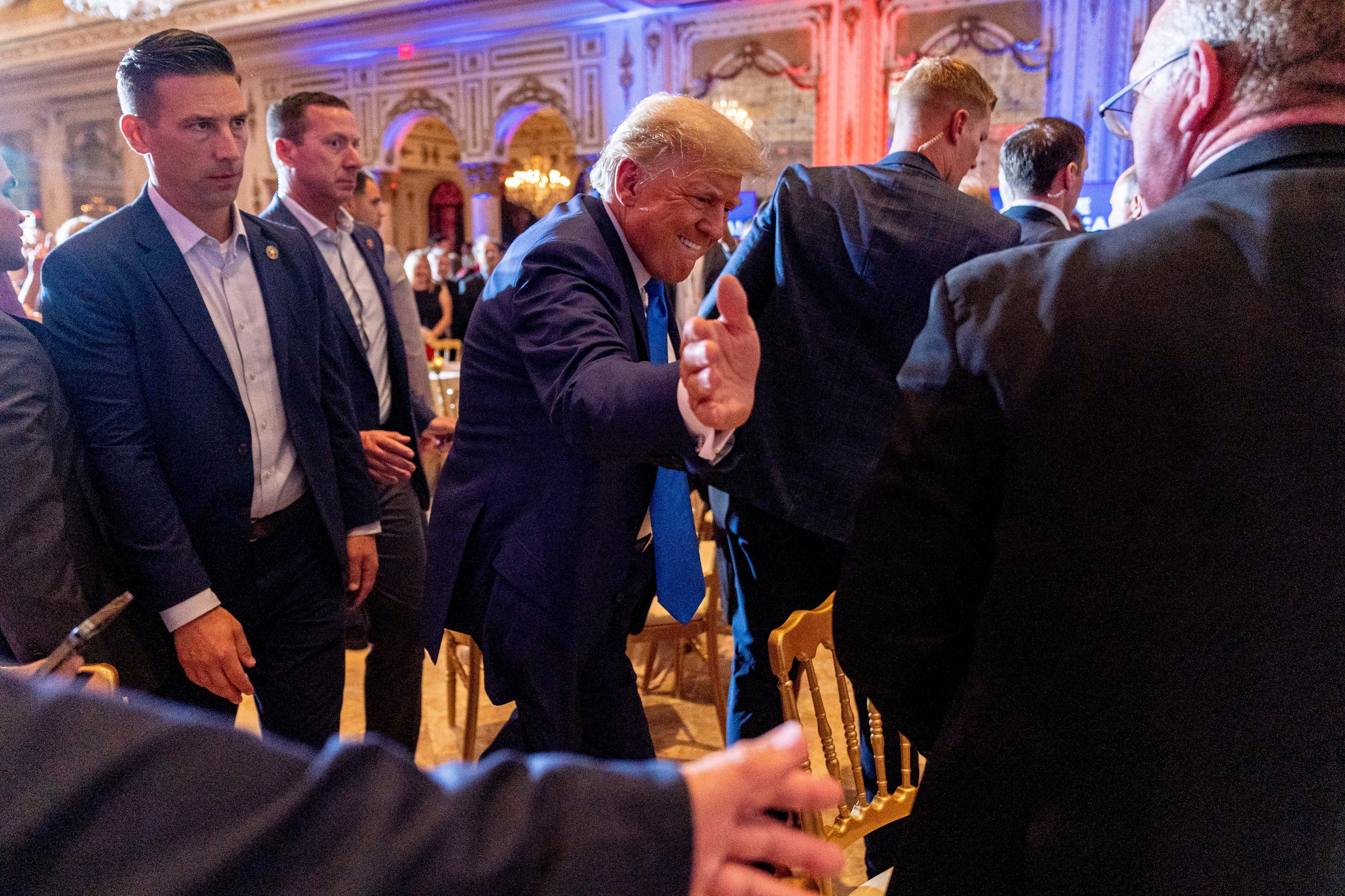 Former President Donald Trump greats guests at Mar-a-lago on the day of the 2022 midterm elections