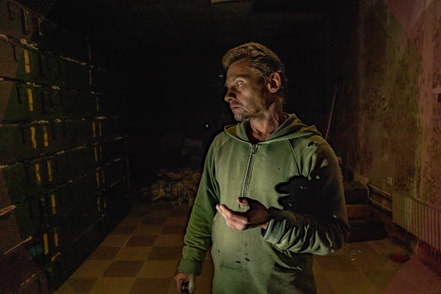 <p>Dymtro explains how was held and beaten in this underground interrogation room in Balakiya </p>