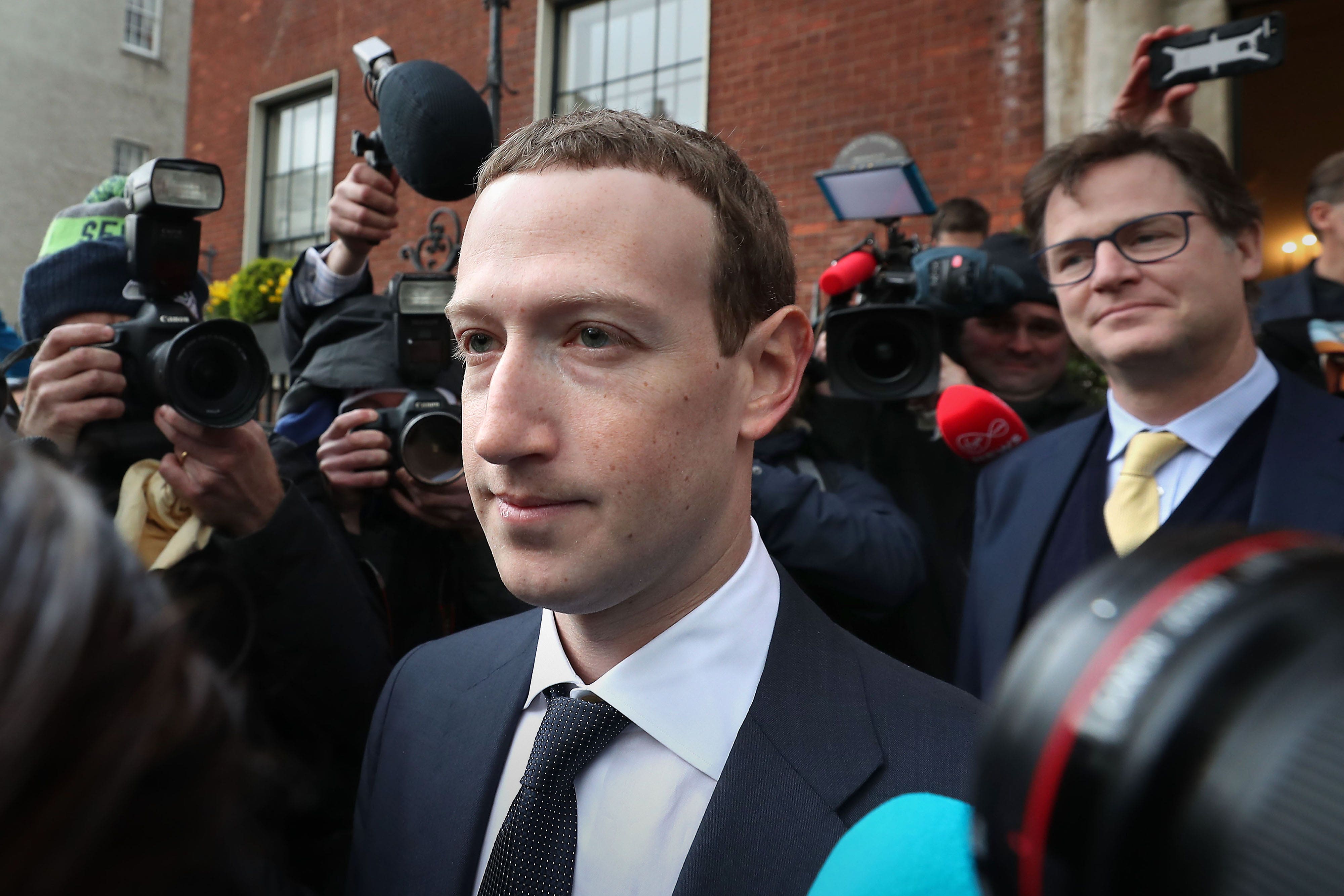 Facebook CEO Mark Zuckerberg leaving The Merrion Hotel in Dublin with Nick Clegg (right) after a meeting with politicians to discuss regulation of social media and harmful content (Niall Carson/PA)