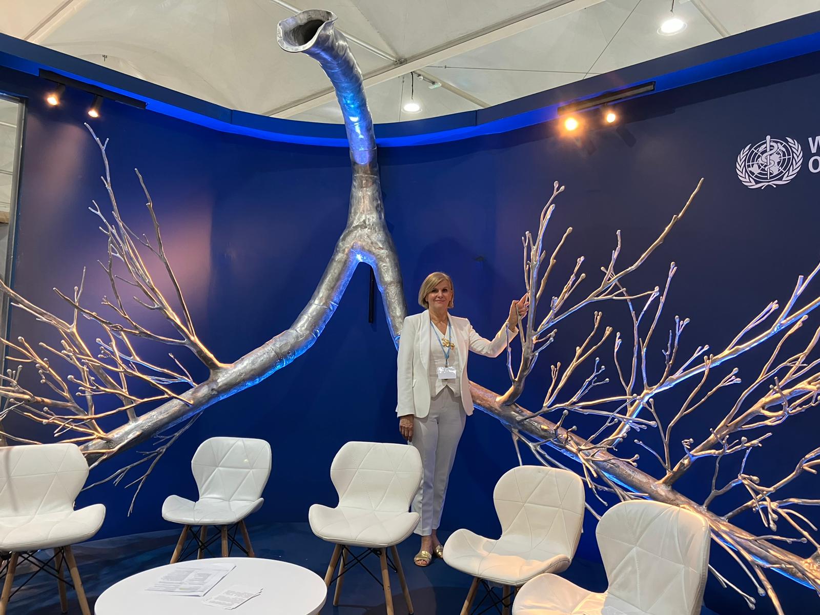 Dr Maria Neira stands next to the giant sculpture of lungs in the World Health Organisation pavilion at Cop27