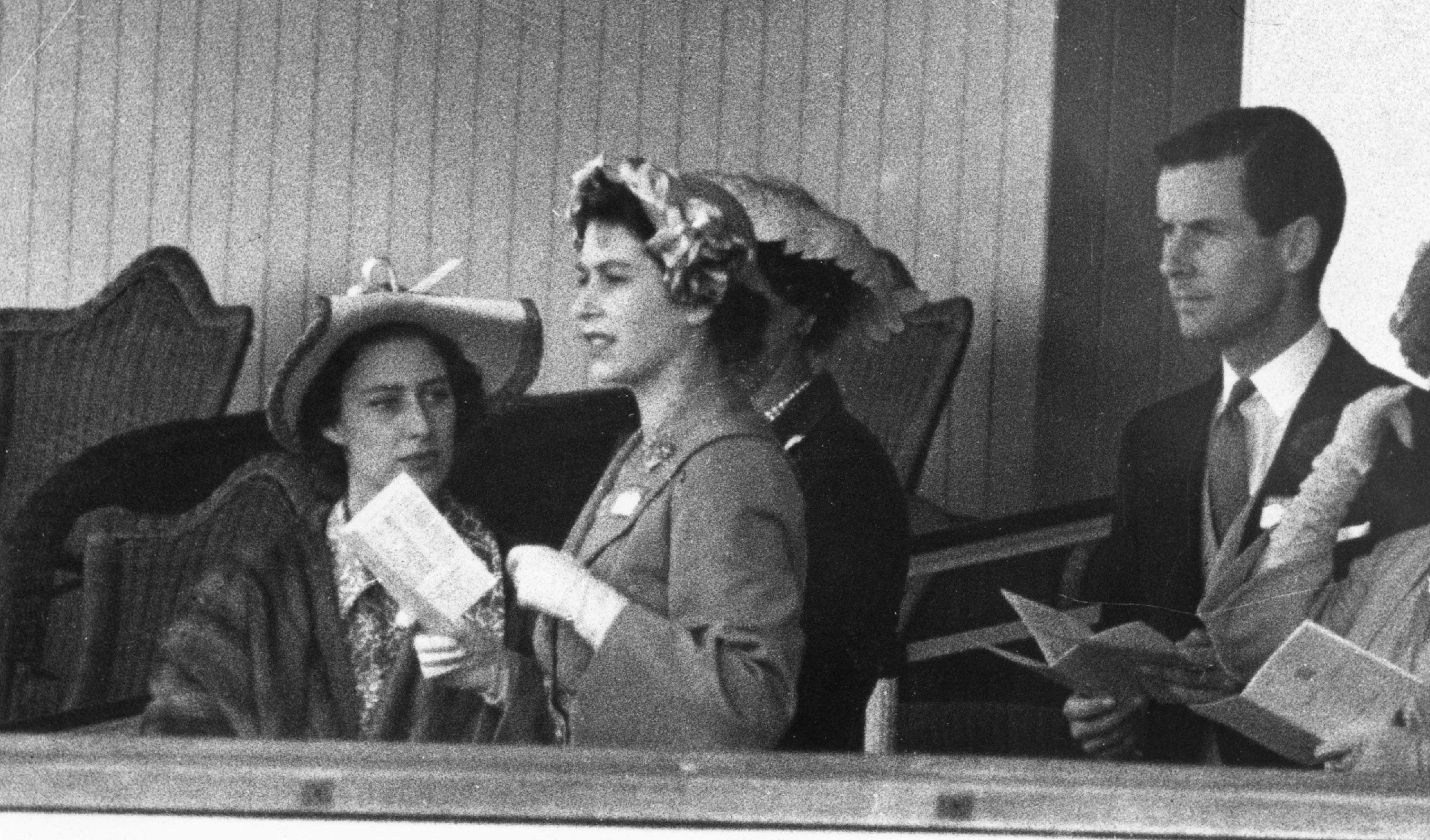 Princess Margaret, Queen Elizabeth II and Group Captain Peter Townsend gather June 13, 1951 in the Royal Box at Ascot