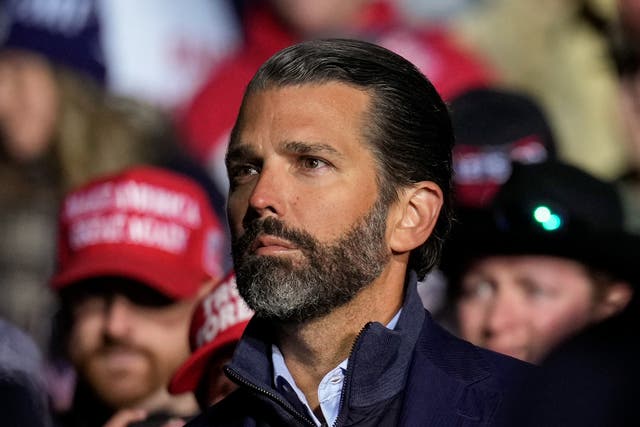 <p>Donald Trump Jr. listens as former President Donald Trump speaks at a rally at the Dayton International Airport on November 7, 2022 in Vandalia, Ohio</p>