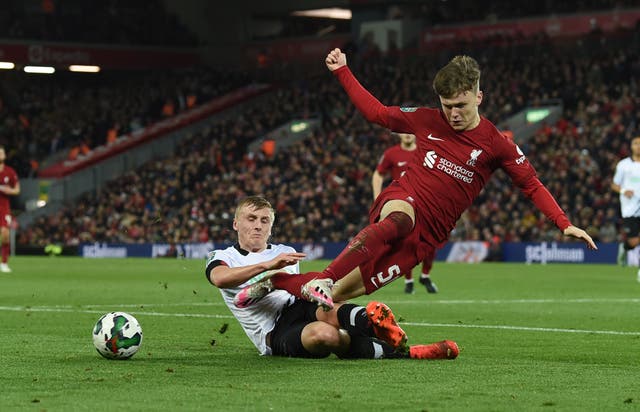 <p>Liverpool’s Ben Doak is challenged </p>