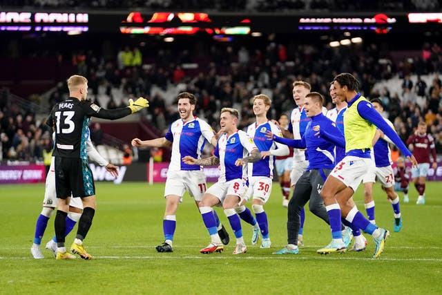 Blackburn players celebrate after knocking West Ham out of the Carabao Cup (Zac Goodwin/PA)