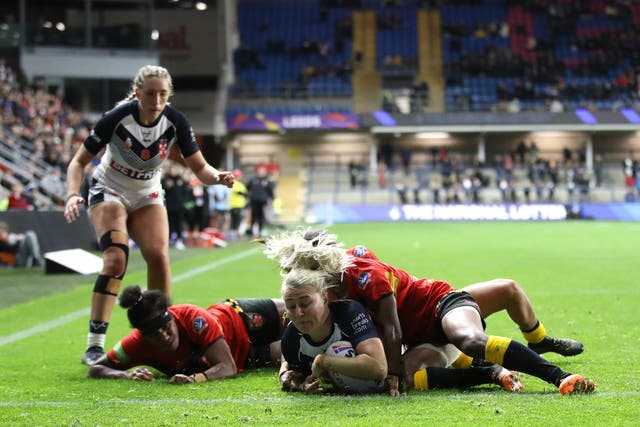 <p>England's Tara-Jane Stanley dives in to score a try</p>