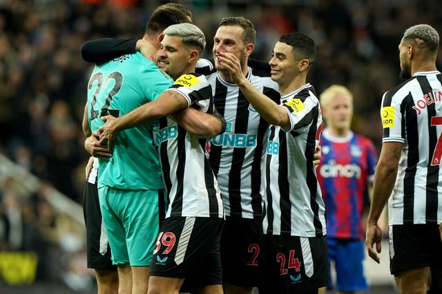 Newcastle goalkeeper Nick Pope celebrates with his team-mates after the penalty shoot-out victory over Crystal Palace (Owen Humphreys/PA)