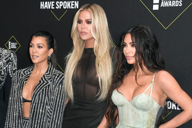 <p>Kourtney Kardashian, Khloe Kardashian, and Kim Kardashian West attend the 2019 E! People's Choice Awards at Barker Hangar on November 10, 2019</p>