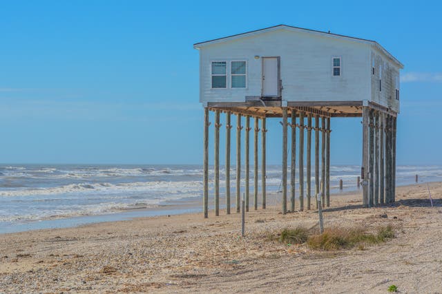 <p>An abandoned house on a Texas beach in the Gulf of Mexico. We can only adapt to the climate crisis up to a point, so we must take action to limit the damage, scientists warn</p>