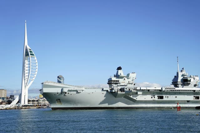 Royal Navy aircraft carrier HMS Queen Elizabeth arrives back into Portsmouth harbour after a visit to the United States (Andrew Matthews/PA)