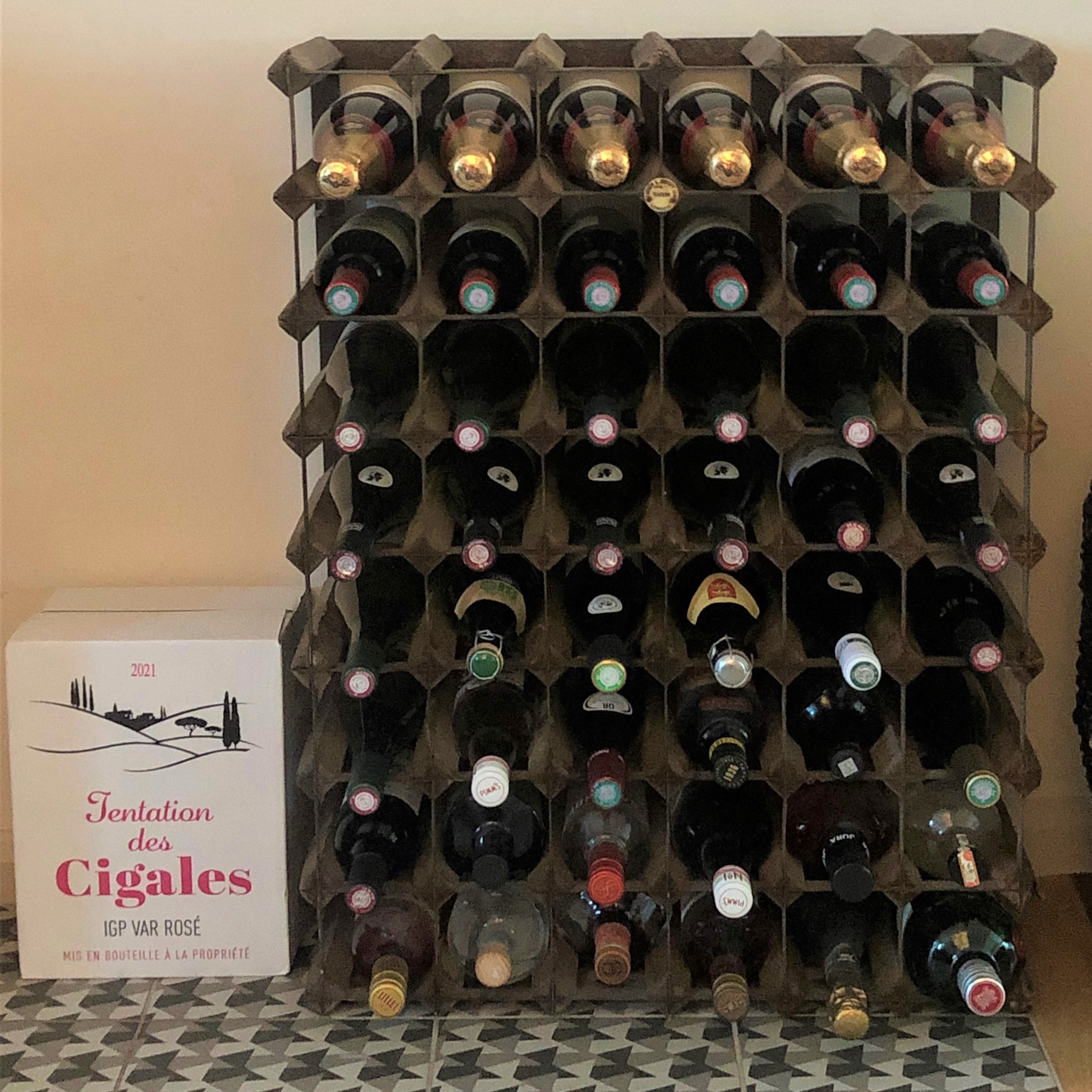 Chris’s proudly replenished wine rack
