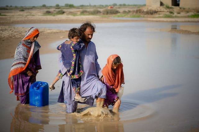 <p>A family in Lasbela, Balochistan, who are among millions whose lives were turned upside down by the recent floods in Pakistan</p>