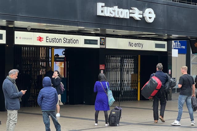 <p>Stay put: Passengers outside London Euston station on the day of the previous drivers’ strike, 5 October 2022</p>