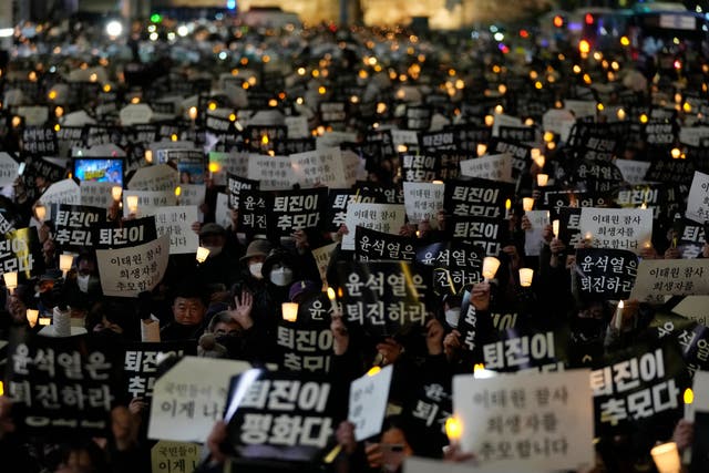 <p>People attend a candlelight vigil for victims of Halloween crowd crush in Seoul, South Korea, Saturday, 5 November 2022</p>