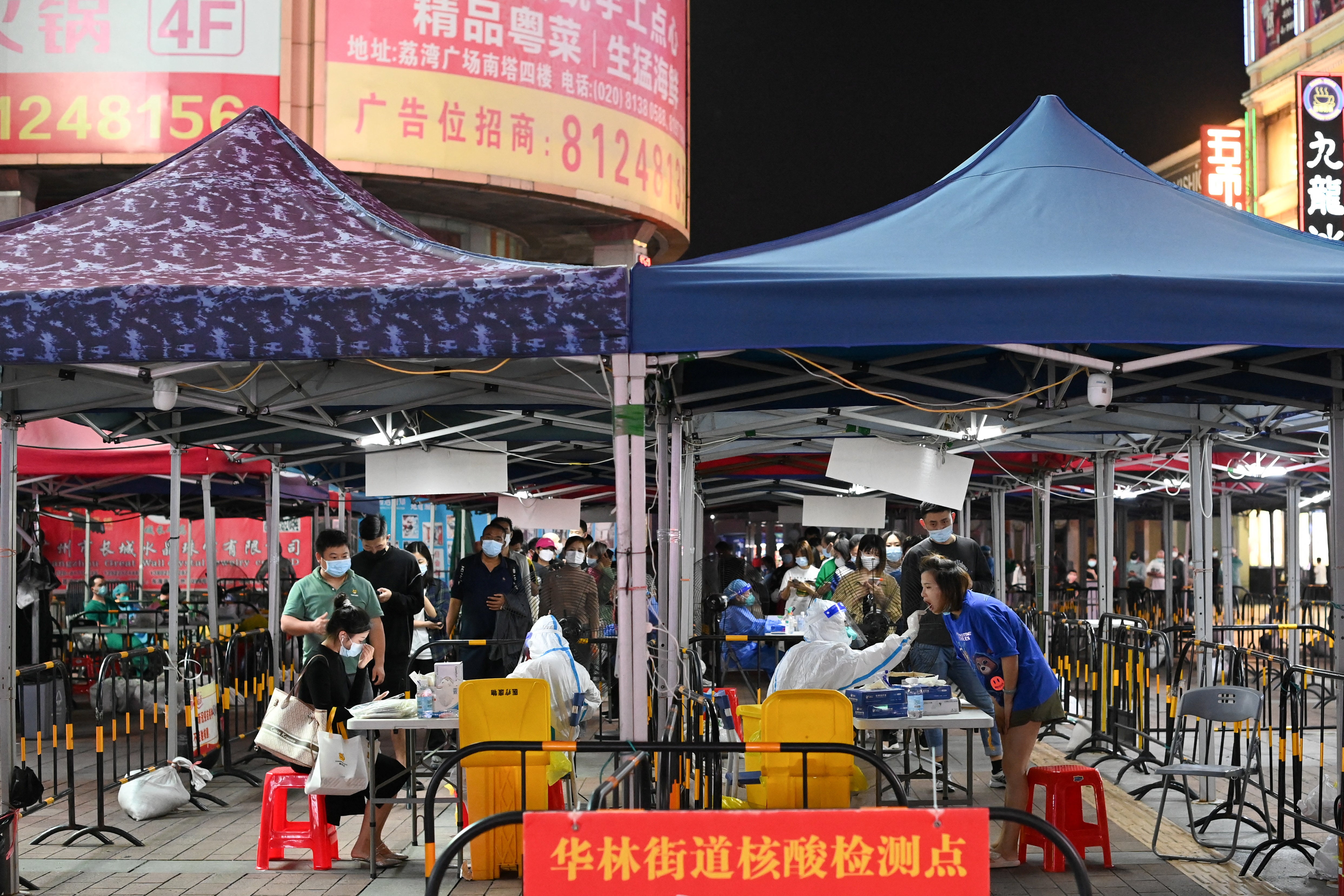 People line up to take nucleic acid test in Guangzhou last week after a recent outbreak