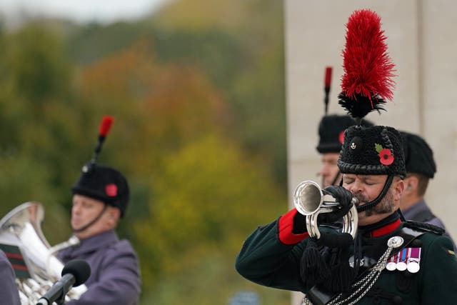 A bugler plays The Last Post during an Armistice Day service, at the National Memorial Arboretum (Jacob King/PA)