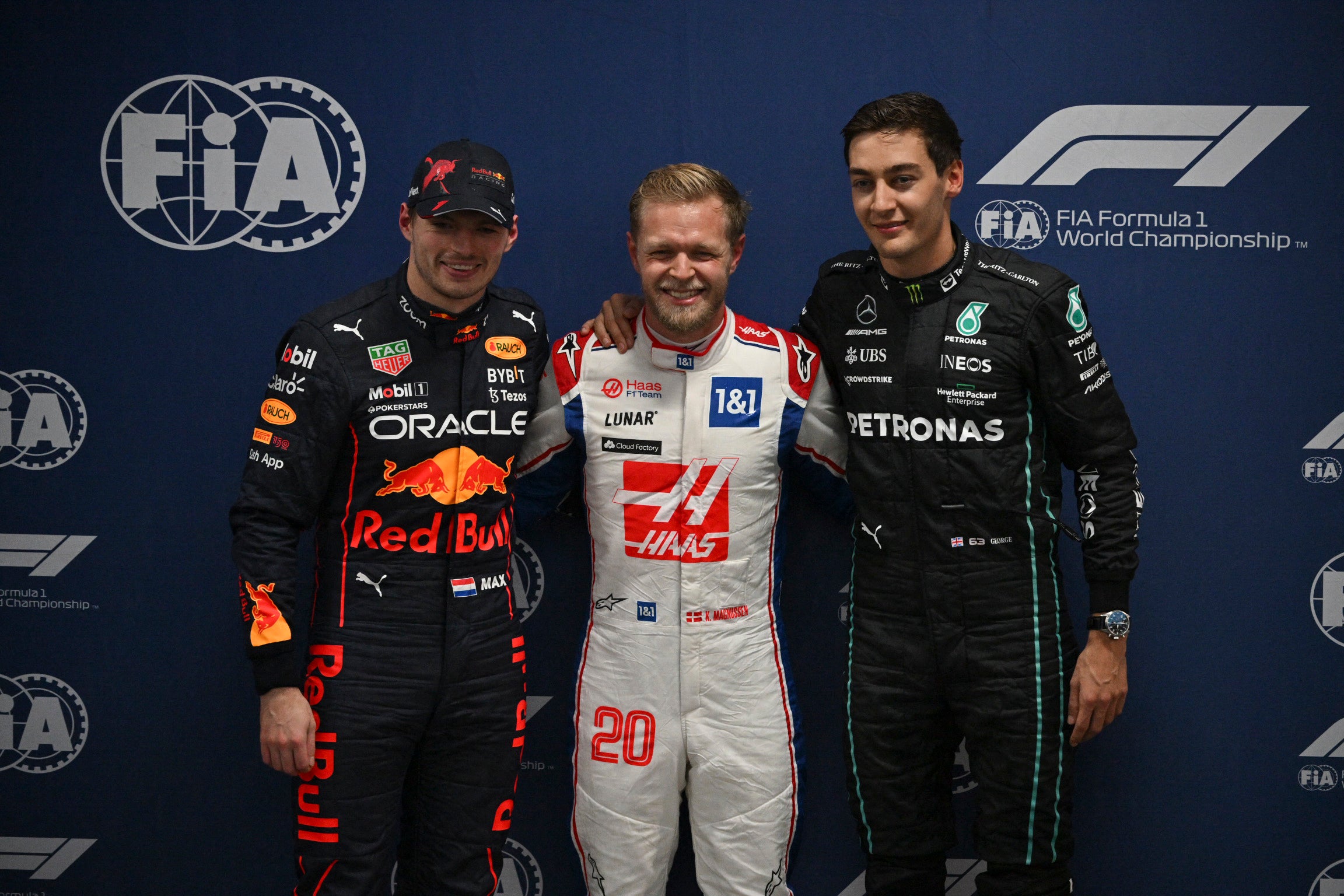 Kevin Magnussen (centre) was in a state of shock after claiming a shock pole position in Brazil