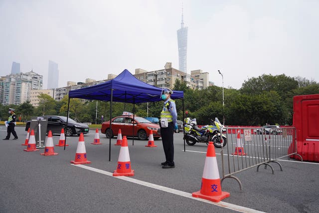 <p>Police officers at a security checkpoint in the Haizhu district in Guangzhou</p>