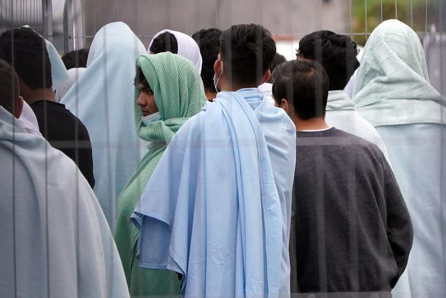 A view of people thought to be migrants inside the Manston immigration centre (Gareth Fuller/PA)