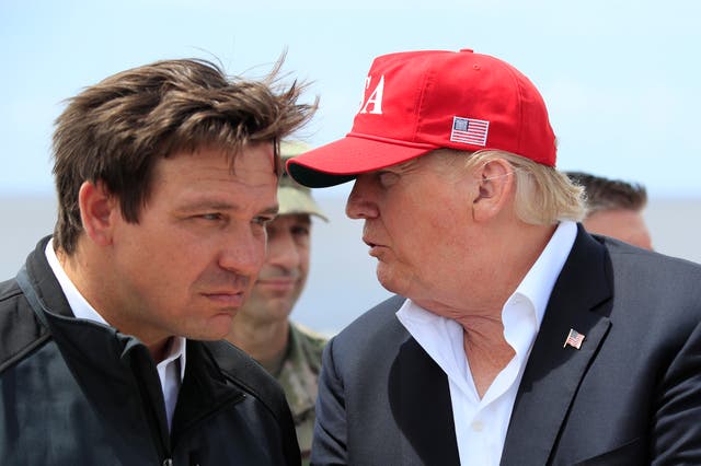 <p>Donald Trump talks to Florida Gov. Ron DeSantis, left, during a visit to Lake Okeechobee and Herbert Hoover Dike at Canal Point, Fla., March 29, 2019</p>