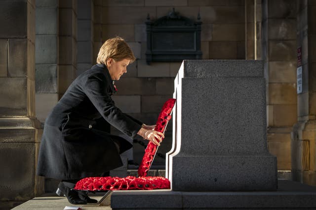 The First Minister laid a wreath at the stone of remembrance (Jane Barlow/PA)