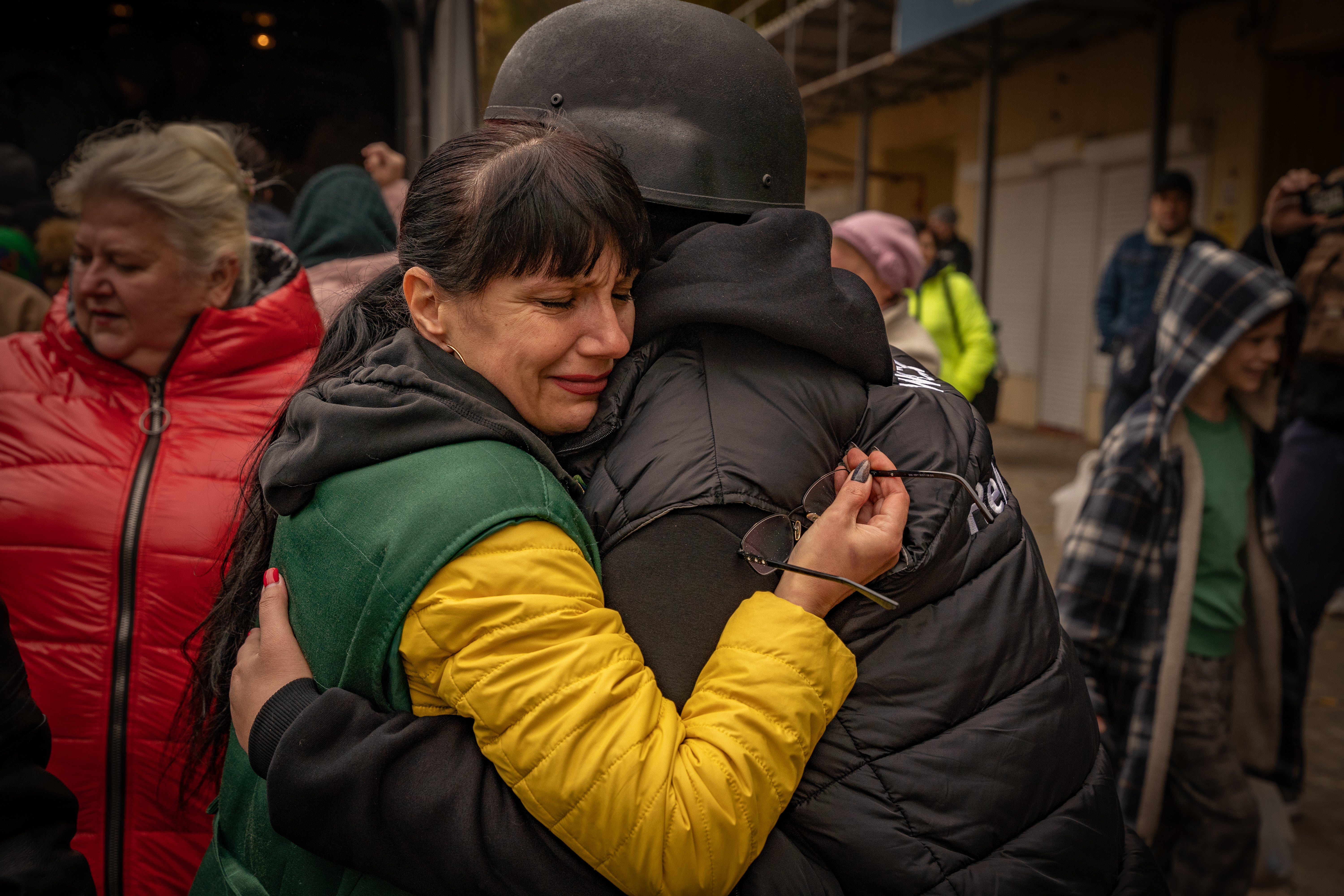 <p>A woman in tears hugs WCK’s regional coordinator, Yuliya Konovalova</p>