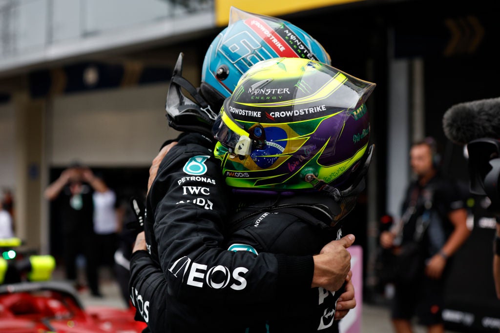 George Russell embraces team-mate Lewis Hamilton as Mercedes took a one-two