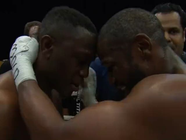 <p>Floyd Mayweather (right) pays respect to Deji after stopping the YouTuber</p>