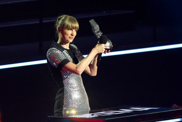 <p>Taylor Swift on stage after winning the award for Best Video at the MTV Europe Music Awards 2022 held at the PSD Bank Dome, Dusseldorf. (Ian West/PA)</p>