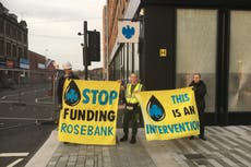 Climate activists smash glass of Glasgow bank