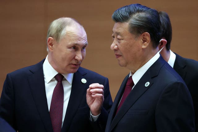 <p>File: Vladimir Putin speaks to Xi Jinping during the Shanghai Cooperation Organisation (SCO) leaders’ summit in Samarkand </p>