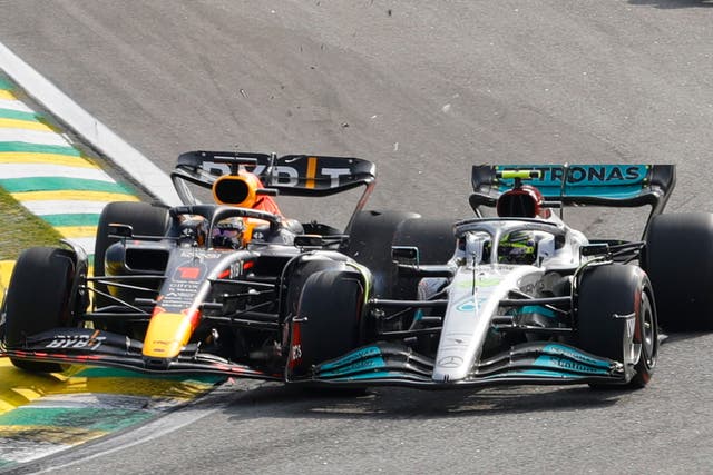 <p>Max Verstappen (left) bumps into Lewis Hamilton during the Brazilian Grand Prix</p>
