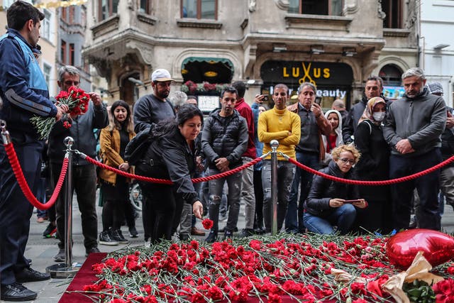 <p>People lay flowers at the site of the deadly explosion on Istiklal Street, Istanbul</p>