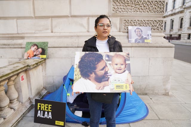 Sanaa Seif, the sister of writer Alaa Abd el-Fattah, a British-Egyptian activist imprisoned in Egypt, protests outside the Foreign Office (Stefan Rousseau/PA)