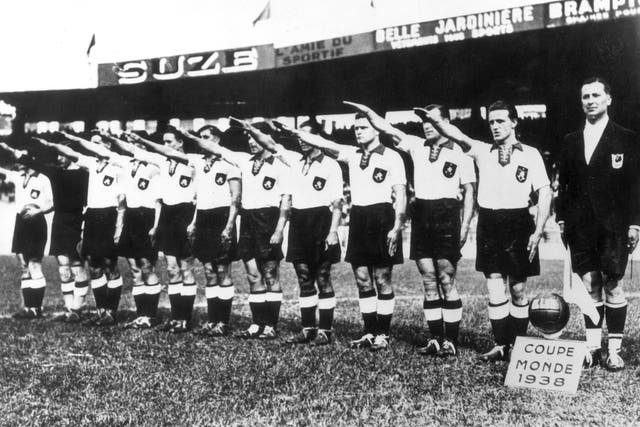 <p>The Germany team perform a Nazi salute during the 1938 World Cup  </p>